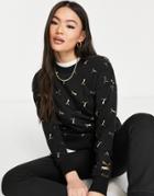 Puma Classics All Over Logo Print Sweatshirt In Black And Gold
