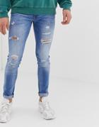 Jack & Jones Skinny Fit Jeans In Light Blue Wash With Rip & Repair Detail - Blue