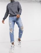 Asos Design Tapered Carrot Jeans In Vintage Light Wash With Heavy Rips-blues