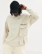 Asos Design Heavyweight Oversized Long Sleeve T-shirt With Utility Pocket Embroidery And Unrivalled Supply Logo-beige