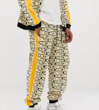 Heart & Dagger Repeat Logo Print Zip Up Jogger-yellow