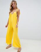 Asos Design Crinkle Low Back Beach Jumpsuit With Tassel Ties In Yellow - Yellow