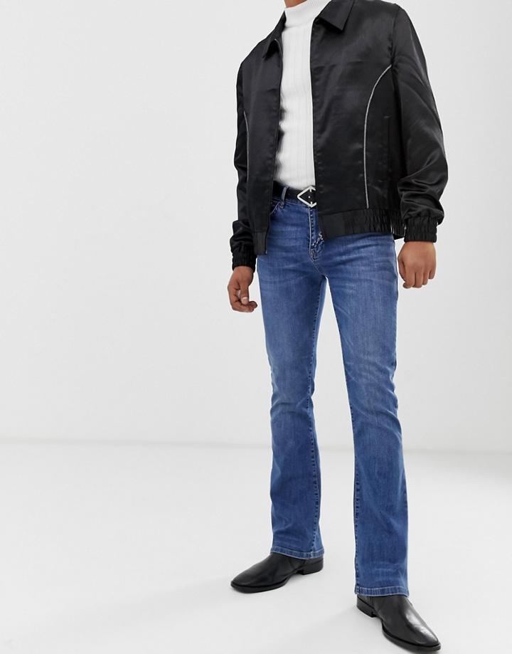Asos Design Flared Jeans In Mid Blue