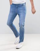 Asos High Waisted Skinny Jeans With Raw Stepped Hem And Waistband In Mid Blue - Blue