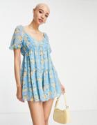 Asos Design Puff Sleeve Tiered Smock Romper In Blue Floral-multi