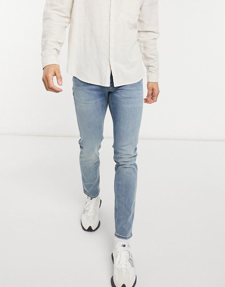 Asos Design Skinny Jeans In Mid Wash-blues