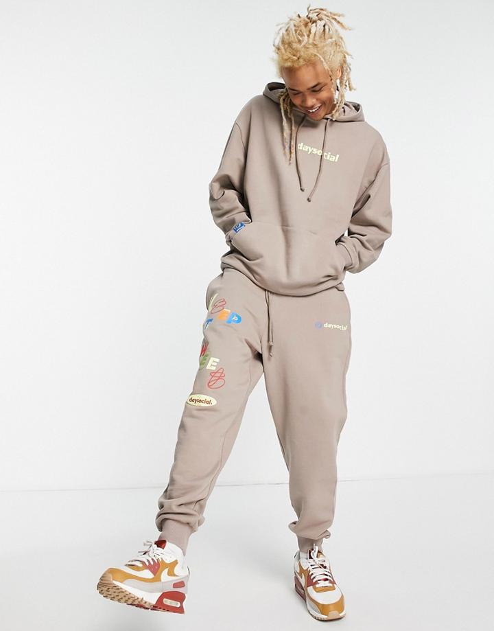 Asos Daysocial Relaxed Sweatpants With Graphic And Logo Print In Brown - Part Of A Set
