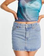 Asos Design Low Rise Denim Mini Skirt In Mid Blue