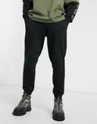Asos Design Organic Tapered Sweatpants In Black