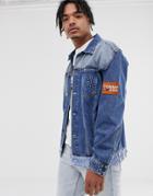 Tommy Jeans Oversize Trucker Jacket With Contrast Hem And Sleeve Badge In Mid Wash - Blue