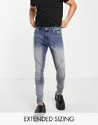 Asos Design Spray On Jeans With Power Stretch In Mid Tint Wash With Moto Detail-blue