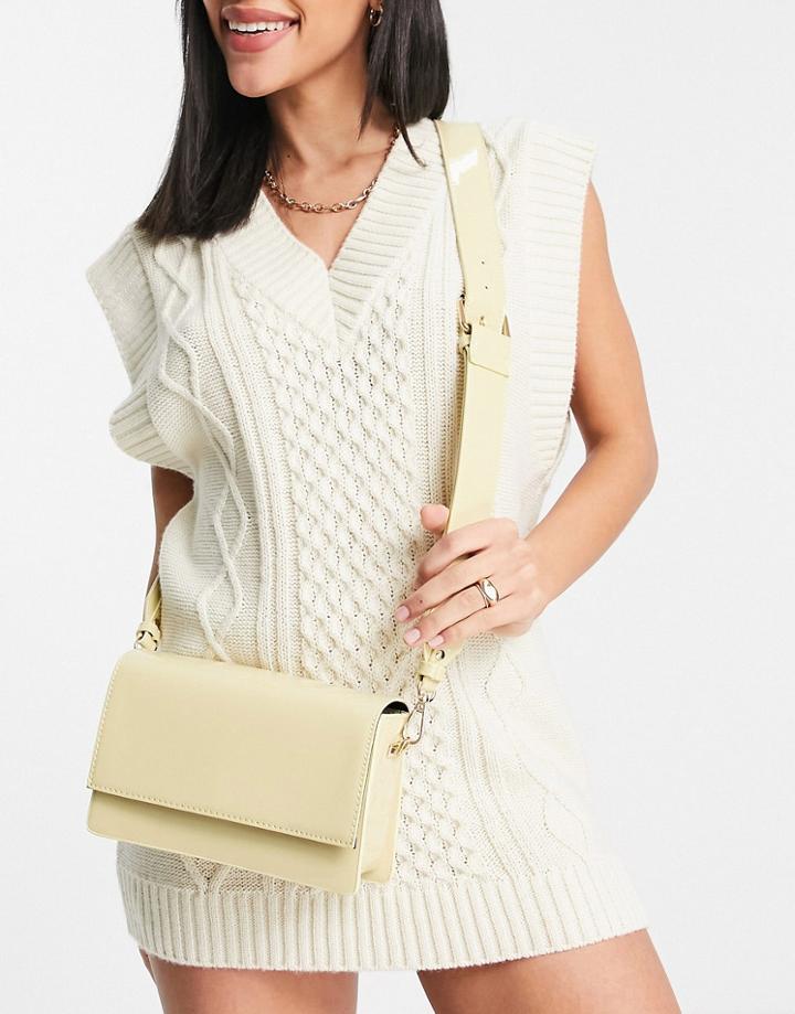 Asos Design Elongated Cross Body Bag In Buttermilk Patent-white
