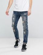 Reason Extreme Distressed Slim Jeans With Paint Splat And Skull Stenci