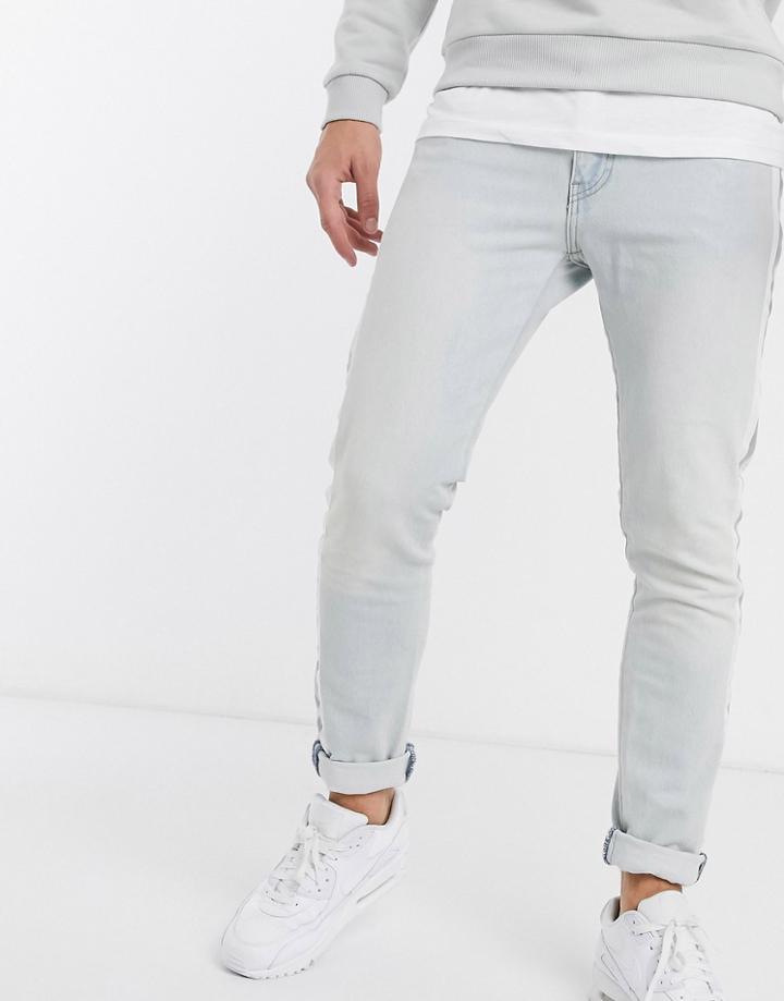 Levi's 512 Reflective Side Tape Slim Tapered Low Rise Jeans In Bleach Light Wash-blue