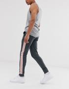 Asos Design Skinny Sweatpants With Side Stripe In Washed Black