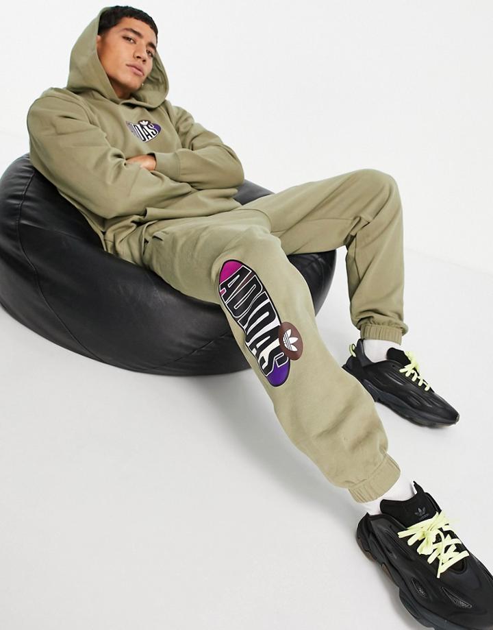 Adidas Originals 'area 33' Tapered Sweatpants In Khaki-green