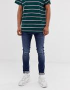 Asos Design Super Skinny Jeans In Dark Wash With Knee Rips - Blue