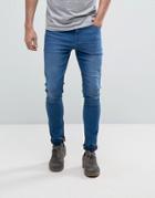 Asos Super Spray On Jeans In Mid Blue - Blue
