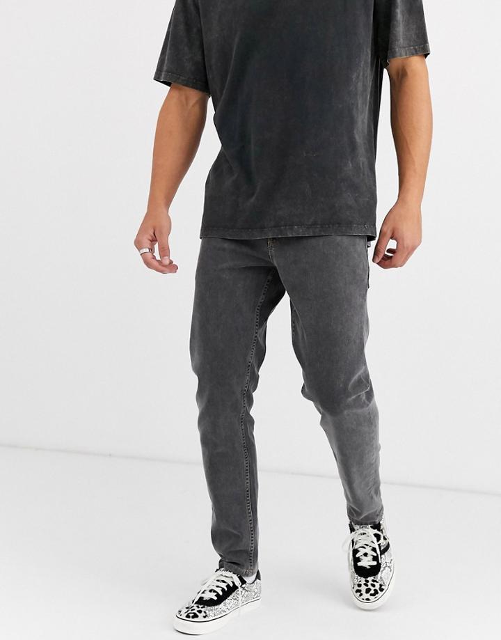 Asos Design Tapered Jeans In Washed Black