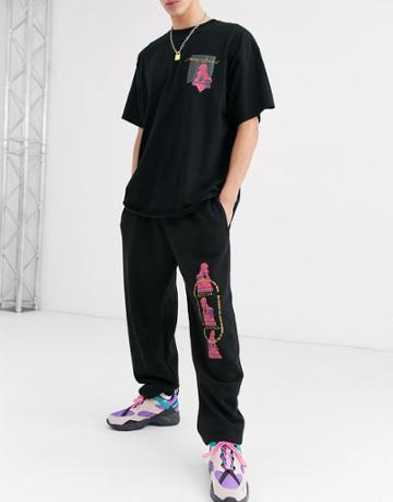 Nothing Is Sacred Pink Print Jogger In Black