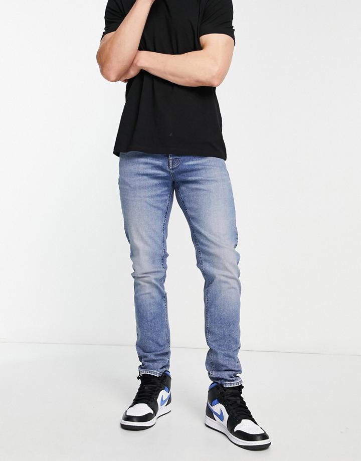 Asos Design Cotton Blend Skinny Jeans In Tinted Light Wash - Lblue - Lblue