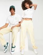 Adidas Originals 'sports Resort' Three Stripe Wide Leg Track Pants In Yellow