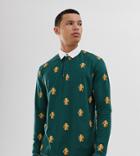 Asos Design Tall Relaxed Long Sleeve Polo With All Over Heritage Print - Green