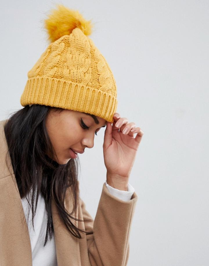 Oasis Cable Knit Beanie With Fur Pom Pom In Yellow - Yellow