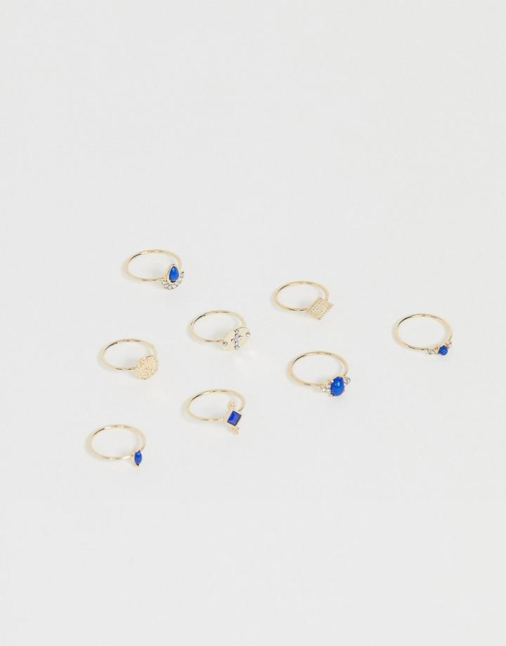 Asos Design Pack Of 8 Rings With Engraved Coin Details And Blue Stones In Gold Tone