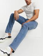 Asos Design Stretch Slim Jeans In Flat Mid Wash Blue
