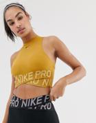 Nike Training Crossover Crop Top In Gold