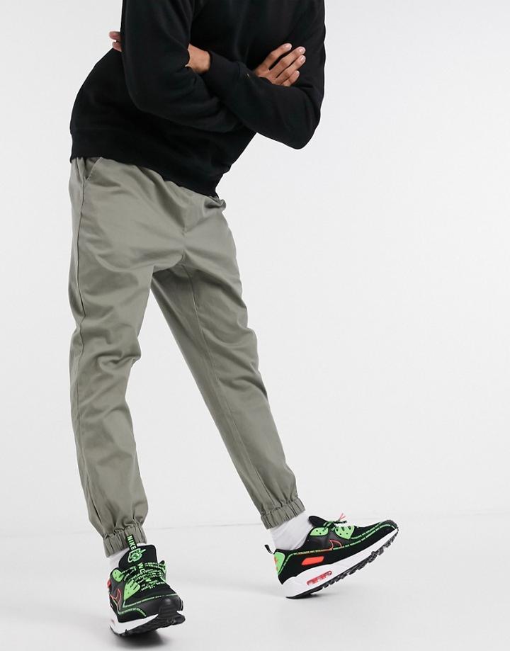 Asos Design Tapered Chino Sweatpants In Khaki-green