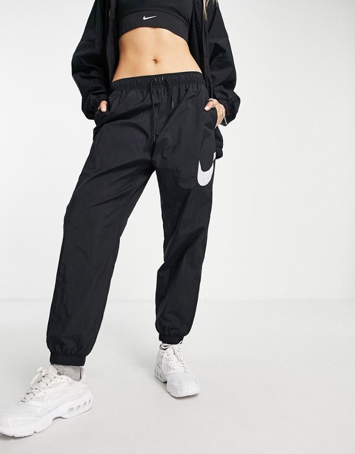 Nike Essential Mid-rise Woven Cuffed Pants In Black