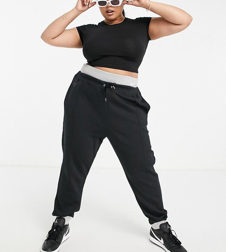 Nike Plus Icon Clash Cuffed Fleece Sweatpants In Black