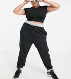 Nike Plus Icon Clash Cuffed Fleece Sweatpants In Black