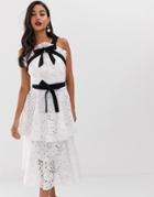 True Decadence Premium Contrast Halter Neck Lace Midi Dress With Bow Detail And Tiered Skirt In White - White