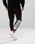 Asos Skinny Tapered Polytricot Joggers With Text Print - Black
