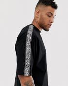 Asos Design Oversized T-shirt With Half Sleeve And Contrast Geo Taping In Black - Black