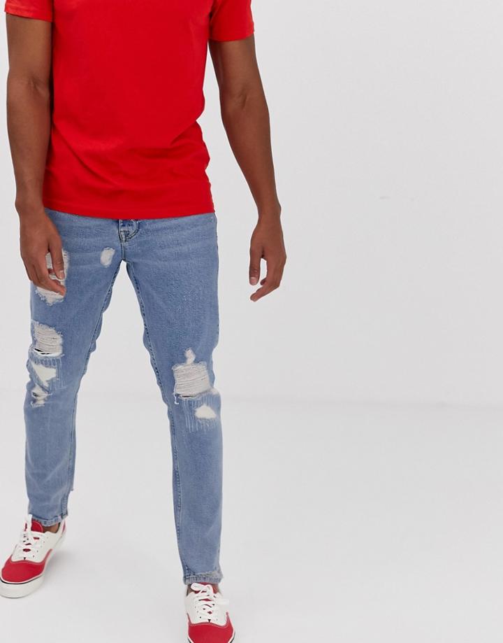 Asos Design Slim Jeans In Vintage Light Wash Blue With Heavy Rips