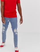 Asos Design Slim Jeans In Vintage Light Wash Blue With Heavy Rips
