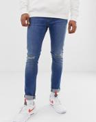 Asos Design Super Skinny Jeans In Mid Wash With Knee Rips - Blue