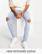 Asos Design Spray On Jeans In Power Stretch In Light Wash With Knee Rips And Raw Hem-blues