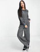 Lola May Ruffle Collar Belted Jumpsuit In Black Gingham