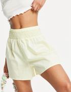 Asos Design Flippy Cotton Shorts With Shirred Waist In Washed Yellow