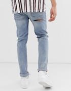 Asos Design Skinny Jeans In Mid Wash Blue With Bum Rips