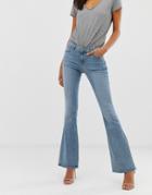 Asos Design Mid Rise Flare Jeans In Light Wash Blue - Blue