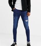 Asos Design Tall Spray On Jeans With Power Stretch In Overydye Blue With Abrasions