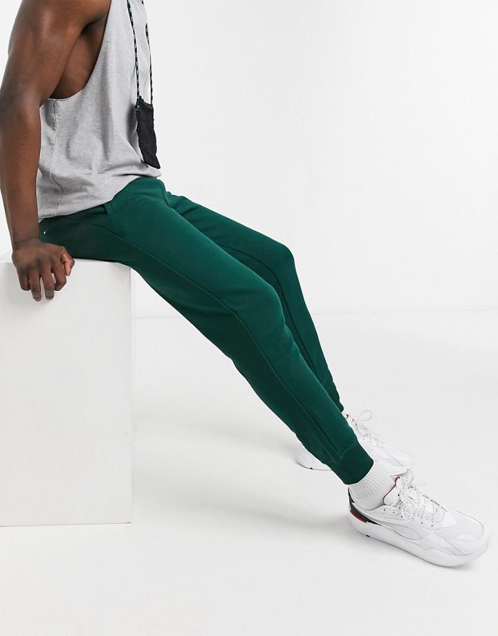 Tommy Hilfiger Printed Logo Cuffed Sweatpants In Hunter Green