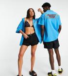 Reclaimed Vintage Inspired Unisex Jersey Shirt In Blue With Palm Logo Print-blues