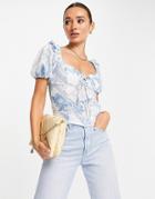 Asos Design Short Sleeved Top With Tie Front In Blue And White Floral Print-multi